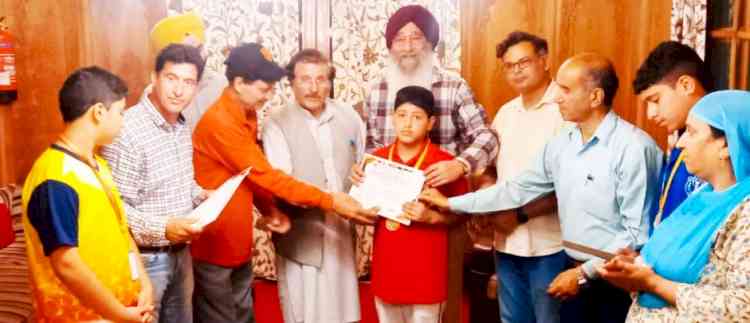 Brahmpura presides over a prize distribution in Srinagar