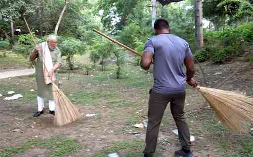 PM participates in cleanliness drive with wrestler Ankit Baiyanpuria