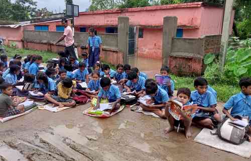 Waterlogged school forces 70 students to study on road in Bihar's Banka