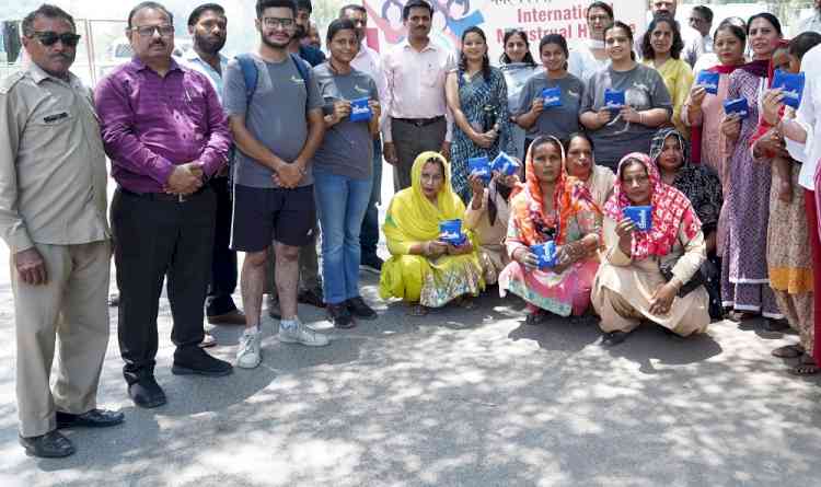 Enactus PU and Versatile Group Ludhiana distributed sanitary napkins in slums on World Menstrual Hygiene Day