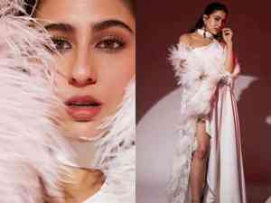 Sara Ali Khan dazzles in white thigh-high slit gown with feather sleeves, dewy makeup 
