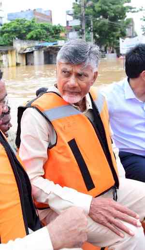 Chandrababu Naidu visits flood-affected Vijayawada in a boat