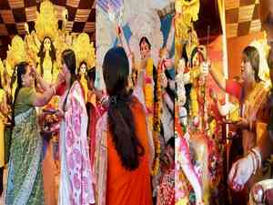 Women in Bengal bid farewell to Goddess Durga with vermillion, sweetmeat offerings