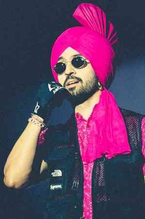 Diljit Dosanjh notices fans watching Ahmedabad show from hotel  balcony without tickets, pauses show