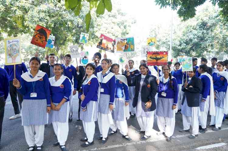 Students of Dev Samaj School give 'save animals' message through a walk