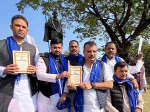 Dressed in blue, Congress MLAs protest at MP Assembly premises holding Constitution's copy 