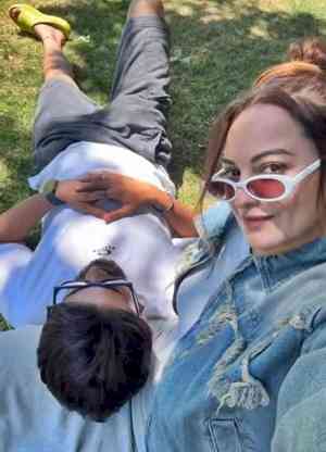 Zaheer Iqbal rests his head on Sonakshi's lap as they soak in sun